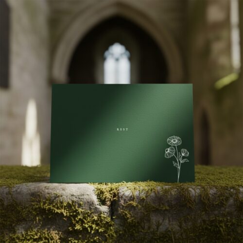 Gethsemane Green Rest greetings card standing on a stone ledge in a church ruin.