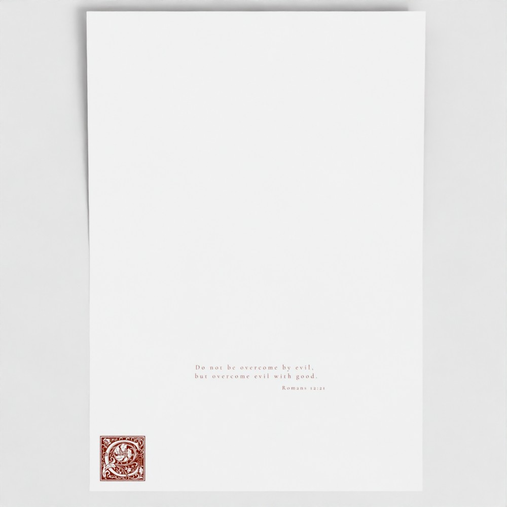 Inside of Cardinal Red Conquer card showing liturgical bible verse and illuminated drop cap letter.