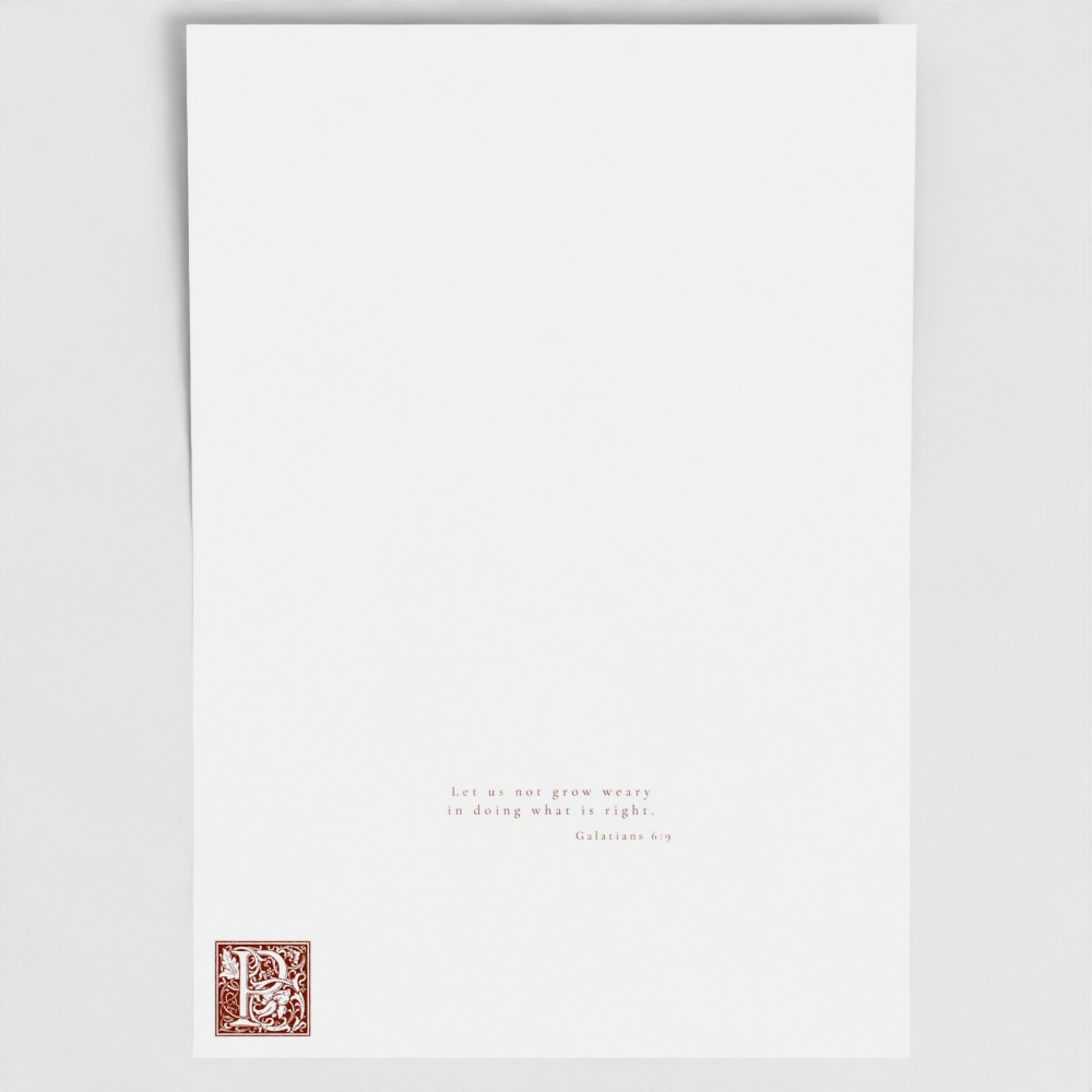 Inside of Cardinal Red Persevere card showing liturgical bible verse and illuminated drop cap letter.