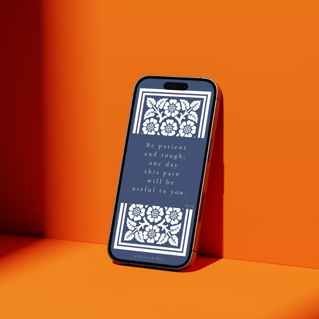 A modern smartphone displaying the Slate Blue Ovid quote wallpaper 'Be patient and tough' on the lock screen.